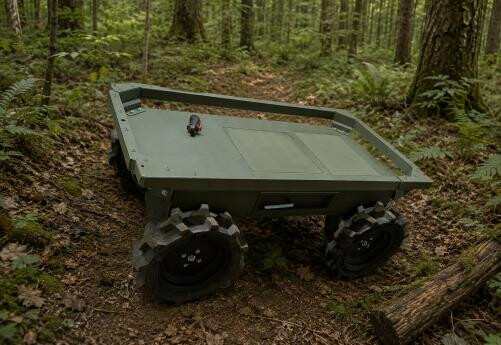 TALOS UGV on a forest track with the stretcher-mount handle fitted